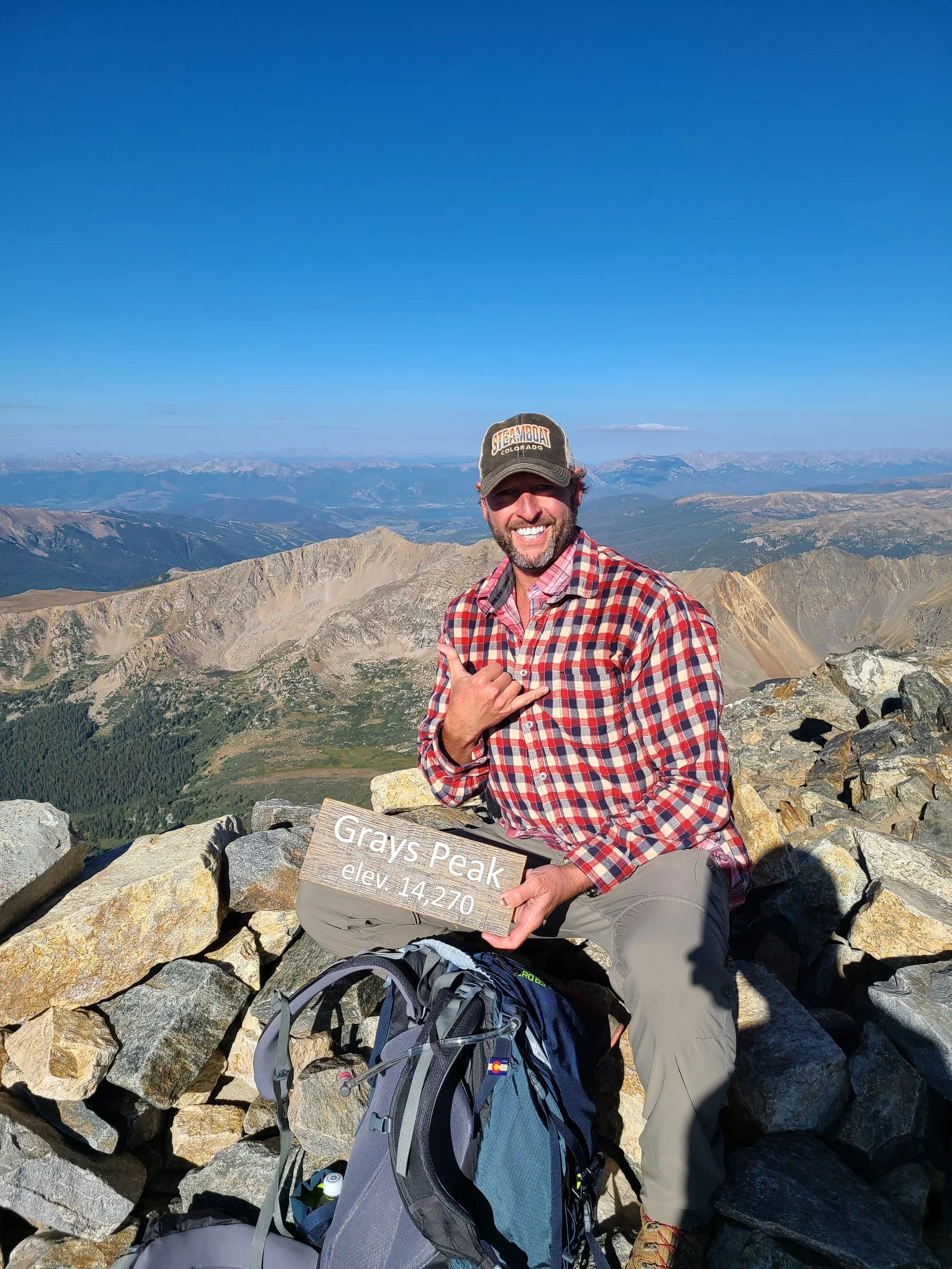 James Miller II at a mountain summit, August 2021